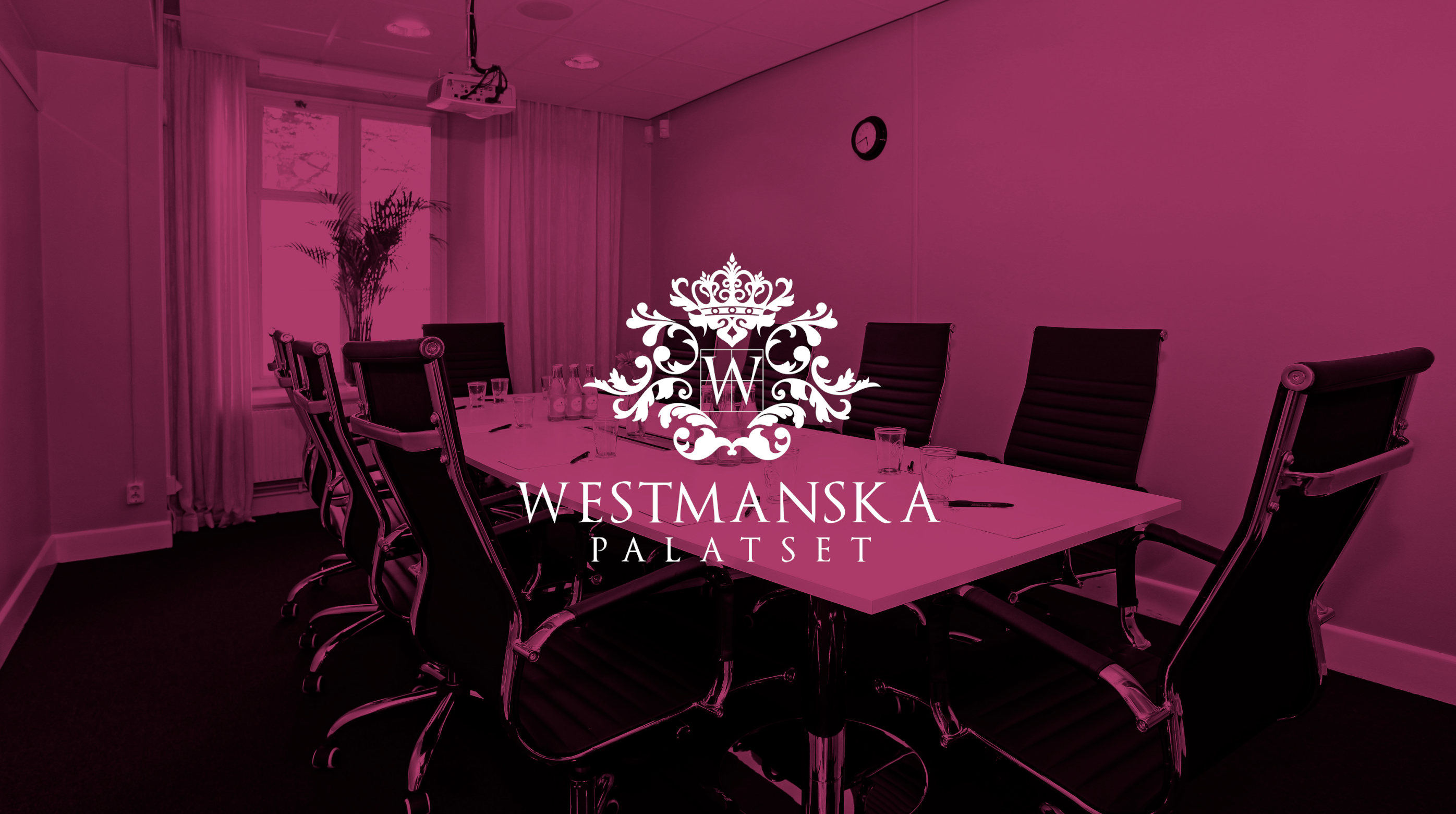 A meeting room with a large table, chairs, and a decorative logo saying "Westmanska Palatset"